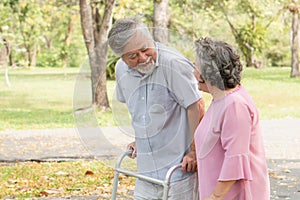Happy elderly couple with lifestyle after retiree concept. Lovely asian seniors couple walking exercise in the park in the morning