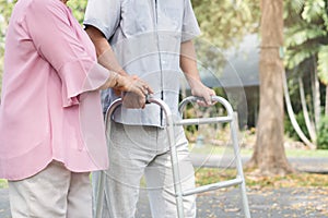 Happy elderly couple with lifestyle after retiree concept. Lovely asian seniors couple walking exercise in the park in the morning