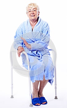Happy elderly lady on shower seat