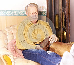 Happy elderly man with his dog