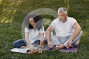 Happy elderly senior couple doing hindu practice