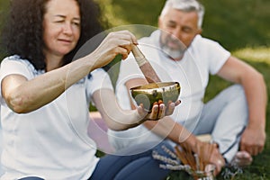 Happy elderly senior couple doing hindu practice