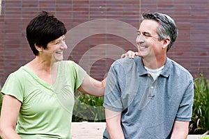 Happy elderly seniors couple in park