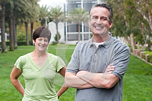 Happy elderly seniors couple in park