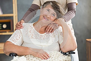 Happy elderly woman at home