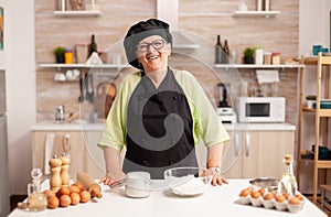 Happy elderly woman wearing bonete photo