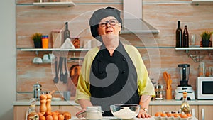 Happy elderly woman wearing bonete photo
