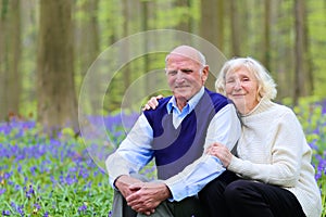 Happy elders couple relaxing in the forest