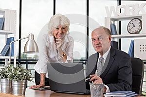 Happy elders in the office photo