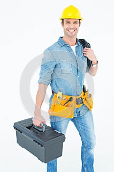 Happy electrician with tool box and wire