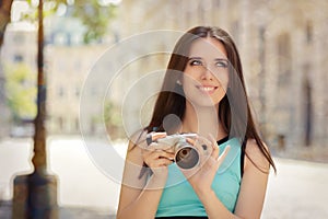 Happy Elegant Woman with Compact Digital Camera