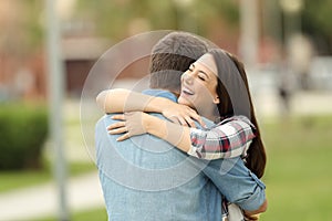 Happy encounter of two friends outdoors photo