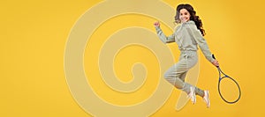 happy energetic child jump in sportswear with squash racquet on yellow background, sport success. Horizontal poster of