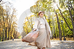 Happy energetic woman taking a walk outdoors