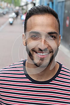 Happy ethnic man smiling close up