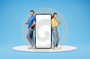 Happy european man and woman standing by big phone