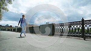 Happy excited businesswoman jumping into blue sky celebrating arms outstretched slow motion