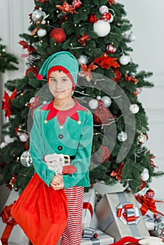 Happy excited child holding christmas gift box