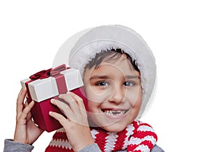 Happy excited child holding christmas gift box