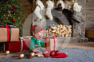 Happy excited child holding christmas gift box