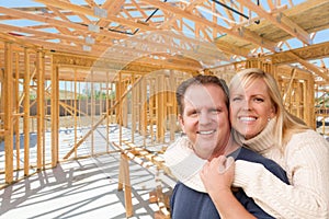 Happy Excited Couple On Site Inside Their New Home Construction