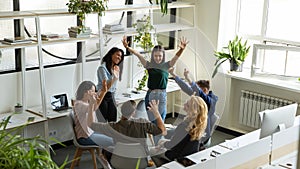 Happy excited diverse teammates friends having fun meeting in office