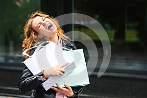 Happy excited emotional girl with shopping bags outside. Crazy woman has a great shopping time. Best seasonal sales. Black friday