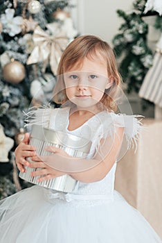 Happy excited girl child holding christmas candy canes. Happy little girl excited at Christmas Eve