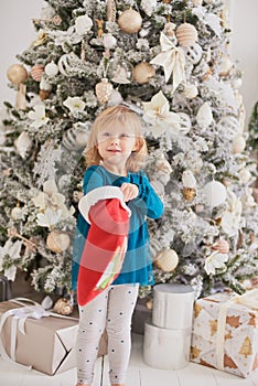 Happy excited girl child holding christmas candy canes. Happy little girl excited at Christmas Eve