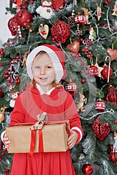 Happy excited girl child holding christmas candy canes. Happy little girl excited at Christmas Eve