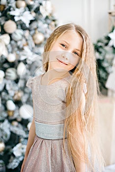 Happy excited girl child holding christmas candy canes. Happy little girl excited at Christmas Eve.