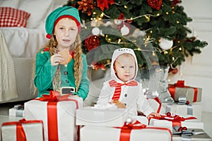 Happy excited girl child holding christmas gift box