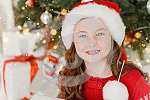 Happy excited girl child holding christmas gift box