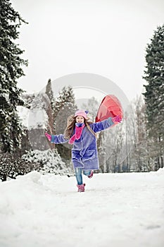 Happy excited girl with Valentine heart balloons outdoor. Valentine`s day concept. Copy space.