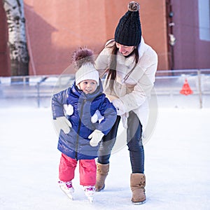 Happy excited little girl and her young mother