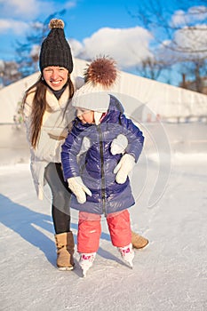 Happy excited little girl and her young mother