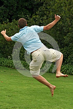 Happy, excited man, jumping in air