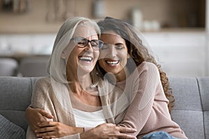 Happy excited senior mom and adult daughter woman having fun