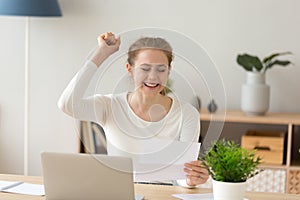 Happy excited teen girl student reading college admission letter