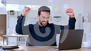 Happy, excited trader scoring a win by buying the right stock in the finance market and celebrating in his office