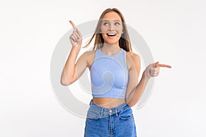 Happy excited woman laughing, pointing fingers sideways, showing left and right product variants, two choices on both sides,