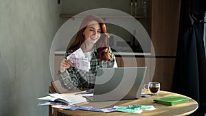 Happy excited young businesswoman holding fan of cash money euro banknotes celebrate, dance, success career, lottery