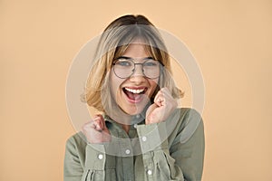 Happy excited young woman student celebrating winning prize with yes gesture.