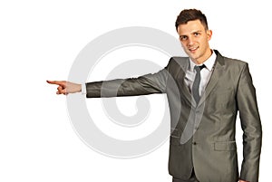 Happy executive man pointing