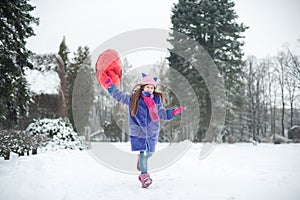 Happy exited girl with Valentine heart balloons outdoor. Valentine`s day concept. Copy space.