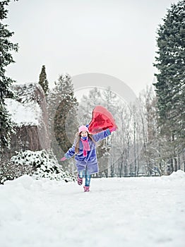 Happy exited girl with Valentine heart balloons outdoor. Valentine`s day concept. Copy space.