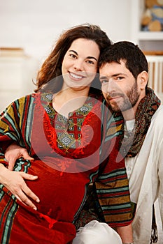 Happy expectant couple in nursery