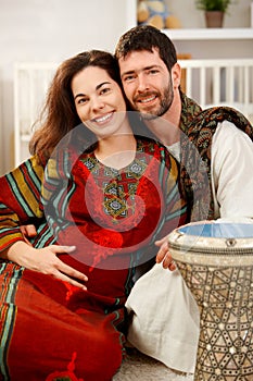 Happy expectant couple in nursery