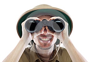 Happy explorer looking through binoculars