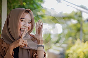 happy expression of muslim woman wearing modern hijab